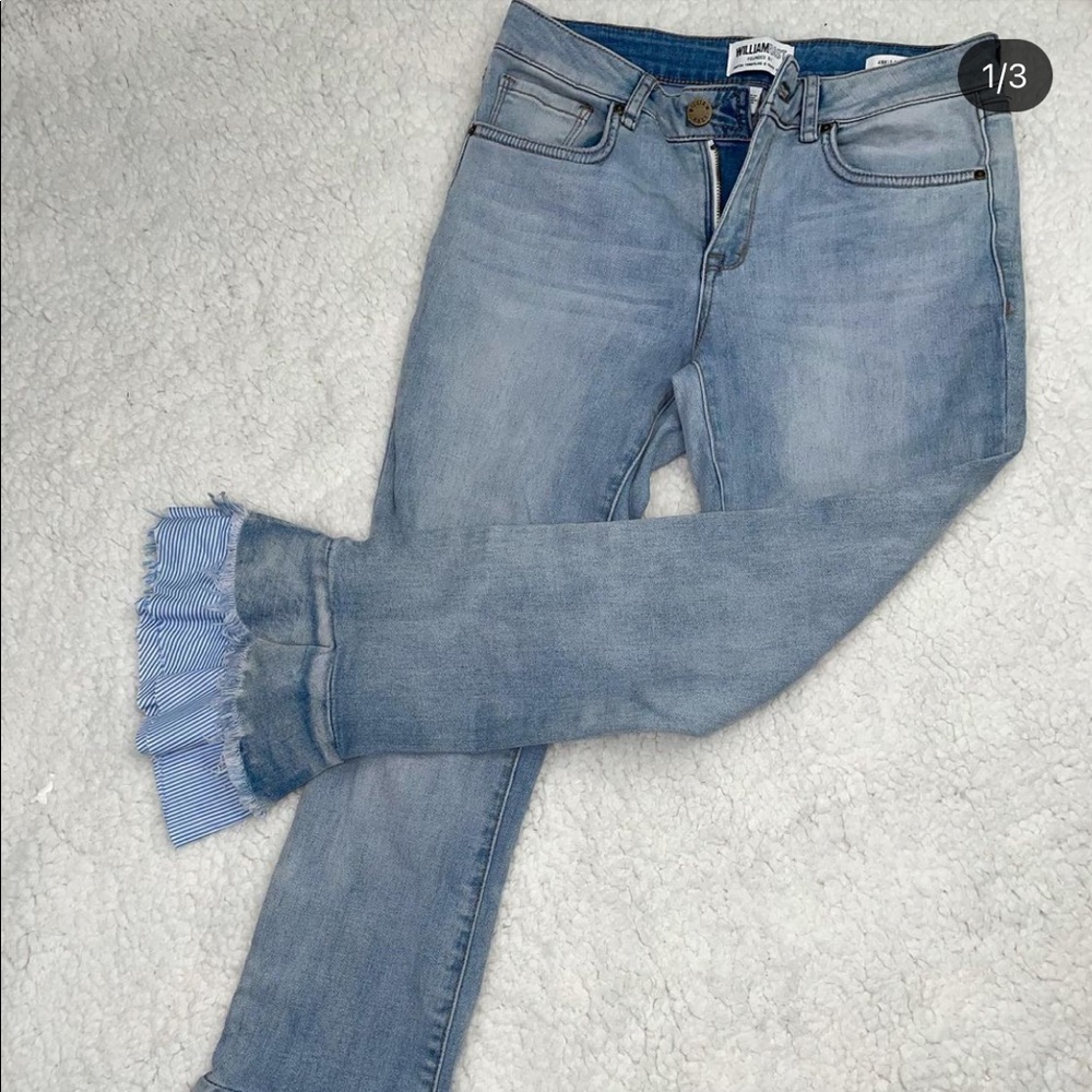 Ruffled flaired ankle light blue jeans